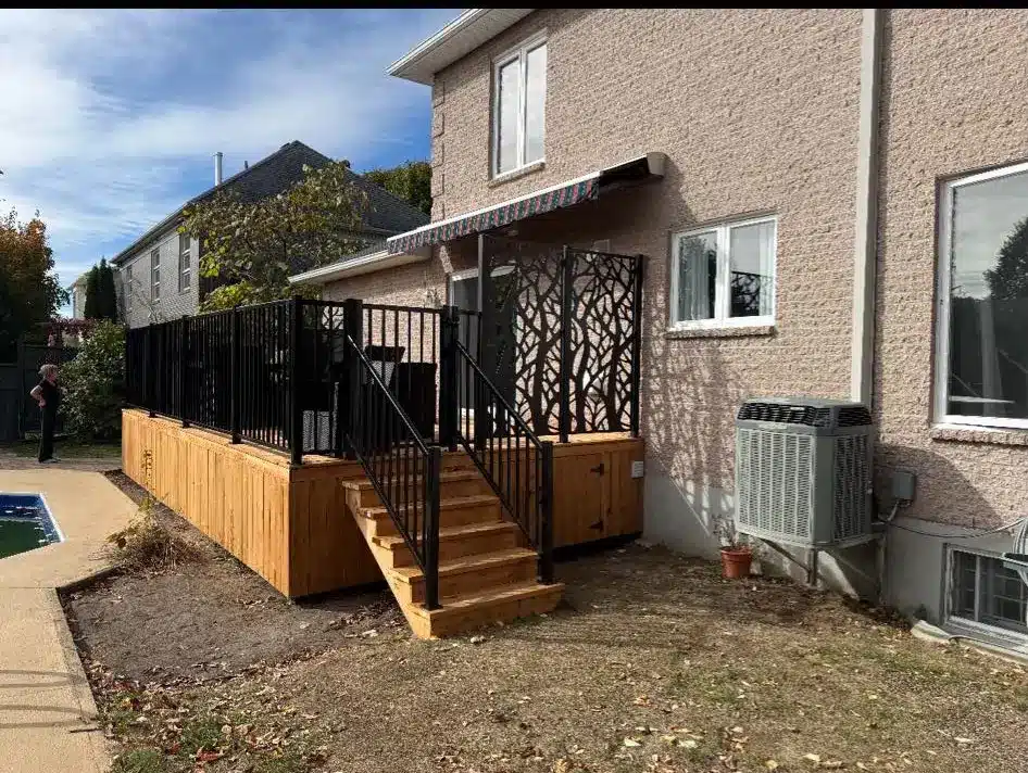 beige house black railing